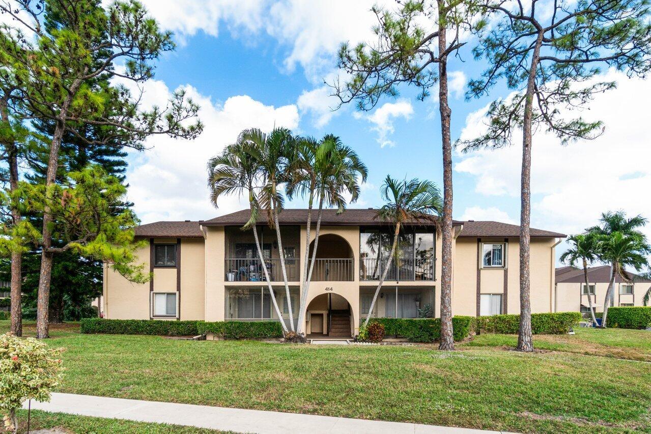 Discover the charm of Pine Ridge, a welcoming 55+ community designed for a comfortable and convenient lifestyle. This second-floor 1 bedroom, 1 bathroom condo with a brand new AC unit. The condo offers serene living space with a host of modern upgrades, including a brand-new electrical panel, roof, and air conditioning. The bedroom provides a cozy retreat with a sitting area, ample closet space, and a private en-suite bath. Step out onto the covered balcony to enjoy your morning coffee or unwind in the evening. For added peace of mind, the window features an accordion shutter for security and storm protection. A dedicated laundry room with a washer and dryer adds everyday convenience. This is a great opportunity to live in a quiet place at an amazing overall value!