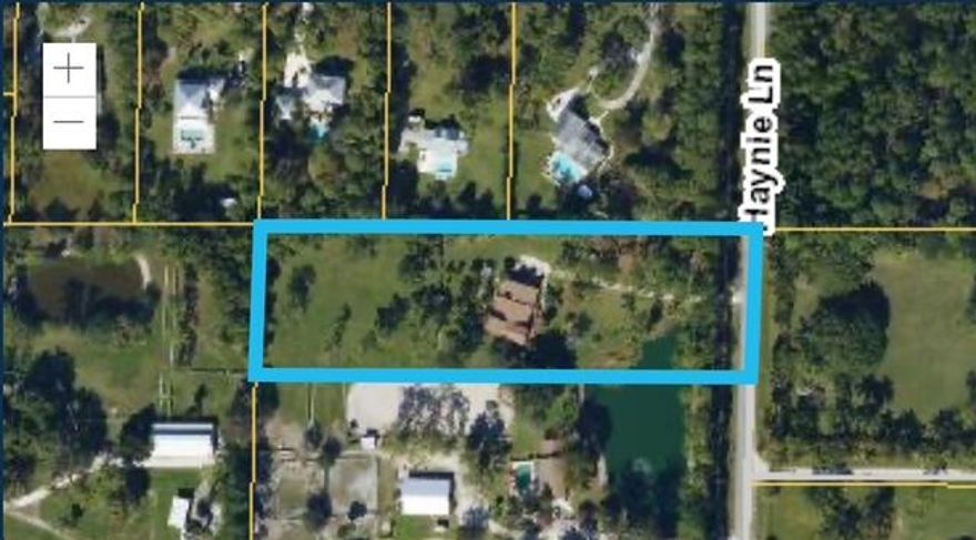Beautiful 2.92 Acre lot on paved road in highly sought after Jupiter Farms! If you have been waiting for a large lot property to make your own, don't miss!  3 Bds/2.5 baths/3 car garage! Home boosts soaring ceilings w multiple decks and patios overlooking the gorgeous yard! Roof 2024, Newly remodeled kitchen. Versatile floor plan w loads of options!  Main house ac living is 2050 sq ft. Primary suite spans the entire upstairs with two balconies overlooking front & back yards and has two rooms, bathroom, & closets, it could also be a 4th bedroom. Main level also features multiple decks and patios. In addition, there is a 492 sq ft enclosed breezeway attached to the 984 sq ft garage/laundry rm/half bath. Could be developed into a guest apartment/In law suite or enclosed for more living space! Live the Jupiter Farms lifestyle in a prime location! Enjoy privacy, space, and flexibility with room for RV's, Boats, animals, a workshop, or future development, ideal for customization, expansion, or multi-use living—all with no HOA!  High and dry with easy access to Jupiter, Palm Beach Gardens, and I-95/Turnpike. Just minutes to gorgeous beaches, watersports, top-rated schools, dining, and shopping! Located in a high-demand area known for limited inventory and strong long-term value, this is a rare opportunity to own large acreage that perfectly blends peaceful country living in a quiet rural setting just minutes from everyday conveniences!