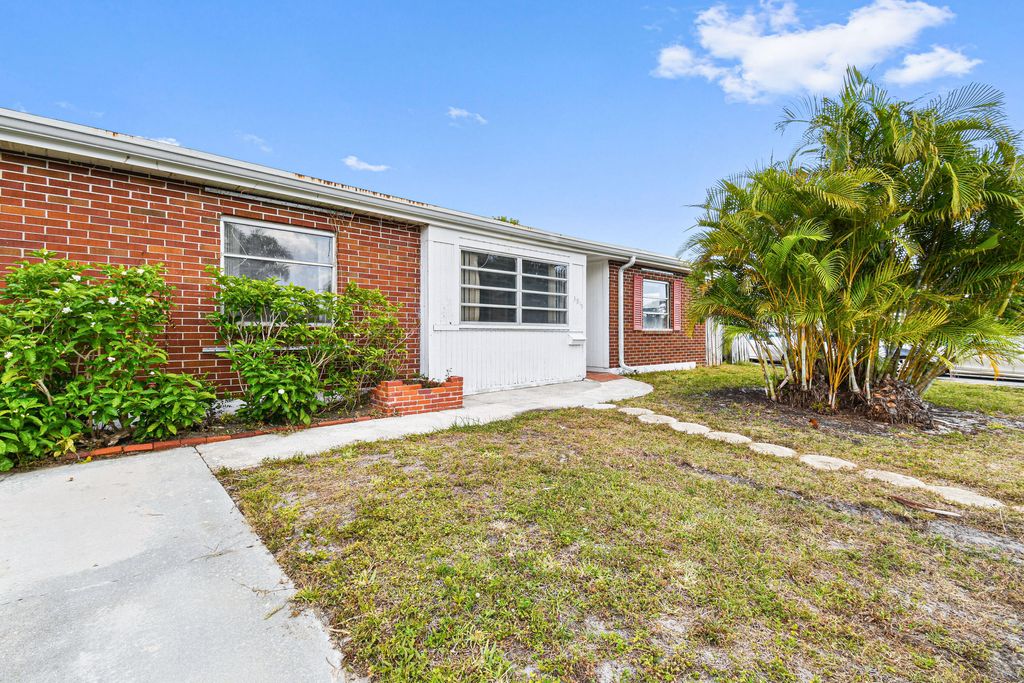 Photo of 3915 Mackinac Road Rd, Lake Worth Beach, FL 33462 (MLS # R10796372)