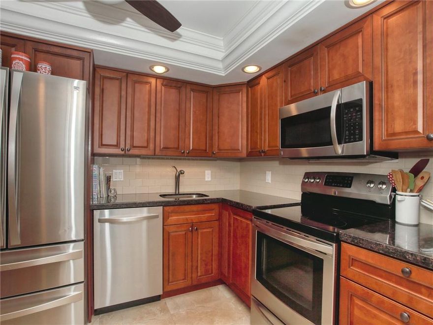 ABSOLUTELY STUNNING!!!  Rare find KING 2-Bed 2-Bath TOTALLY RENOVATED condo for SALE. Property features modern 24x24 porcelain tile and wood flooring, extra-large "L" shaped balcony overlooking the Cypress Golf course and lake. Remodeled kitchen with wood cabinets, granite countertop, STAINLESS STEEL appliances and recessed lighting. Full size WASHER AND DRYER inside unit, large guest ensuite. Condo has been TASTEFULLY DECORATED and it is being sold fully furnished. Tons of closet space. You will love this UNIQUE floor plan.  PALM-AIRE is a golf community with easy access to two major highways, close to shopping, The ISLE CASINO, a 20-minute drive to the Fort Lauderdale airport and just minutes to the beach. PALM-AIRE welcomes ALL AGES. Schedule a showing today. THIS WILL NOT LAST!!!