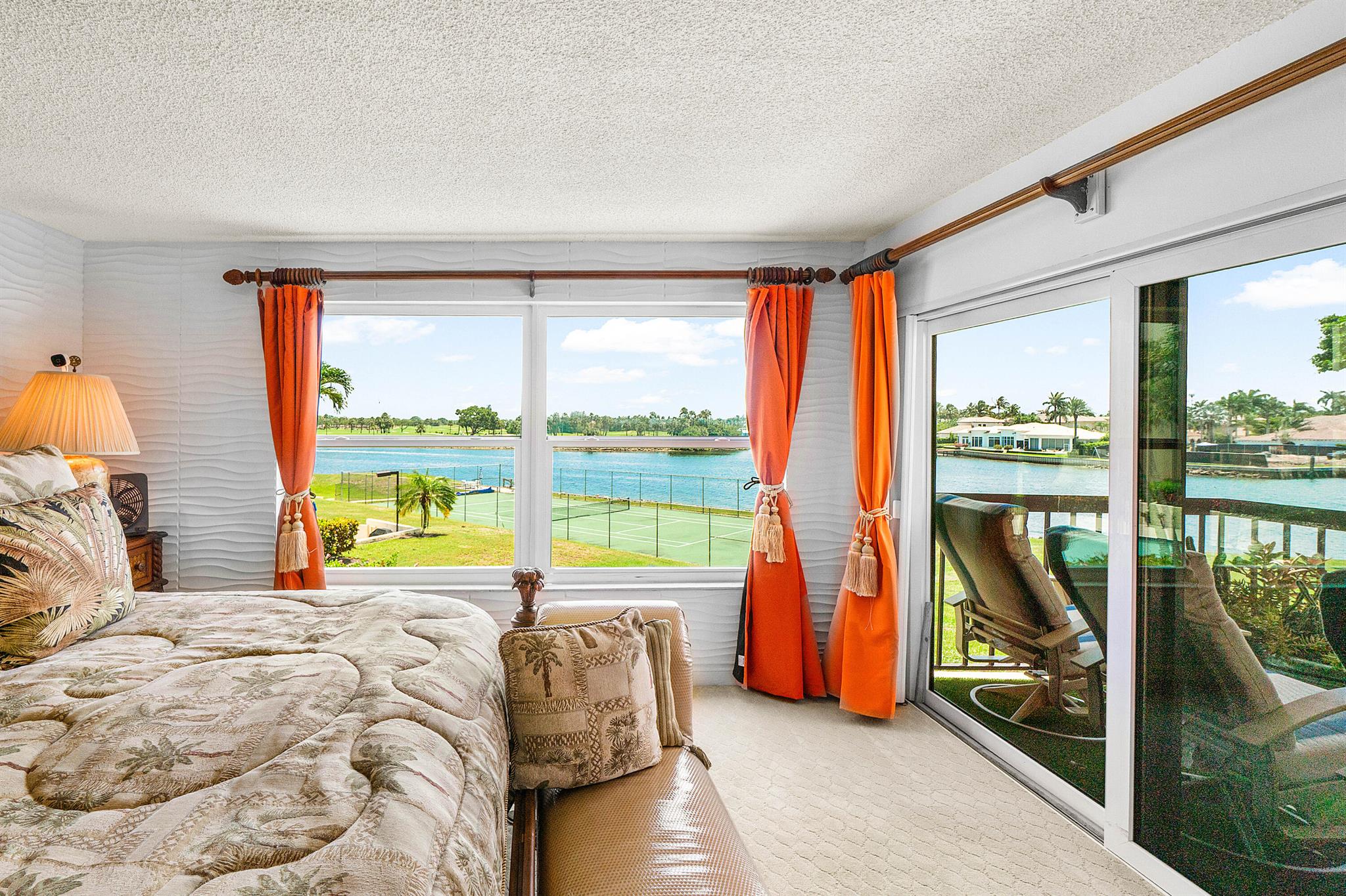 Welcome to this beautiful waterfront corner residence in the heart of North Palm Beach, where boating, golf, and coastal charm set the scene for everyday living. From your private balcony, enjoy sweeping views of the Intracoastal and golf course. Nearly 2,000 square feet of living space includes a large living and dining area, an open kitchen with granite countertops and stainless steel appliances, spacious bedrooms, impact windows, in-unit laundry, and ample storage. This home is available fully furnished for a turnkey move-in, offering convenience and flexibility to the new owner. Resort-style amenities include a pool, tennis courts, waterfront deck, secured elevator, and covered parking.