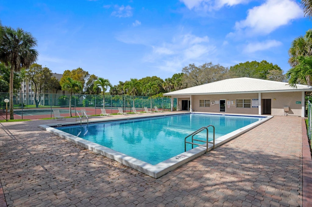 Photo of 8735 RAMBLEWOOD Drive #409, Coral Springs, FL 33071 (MLS # B26073962)