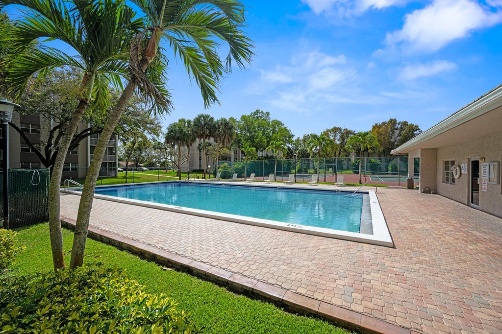 Photo of 8735 RAMBLEWOOD Drive #409, Coral Springs, FL 33071 (MLS # B26073962)