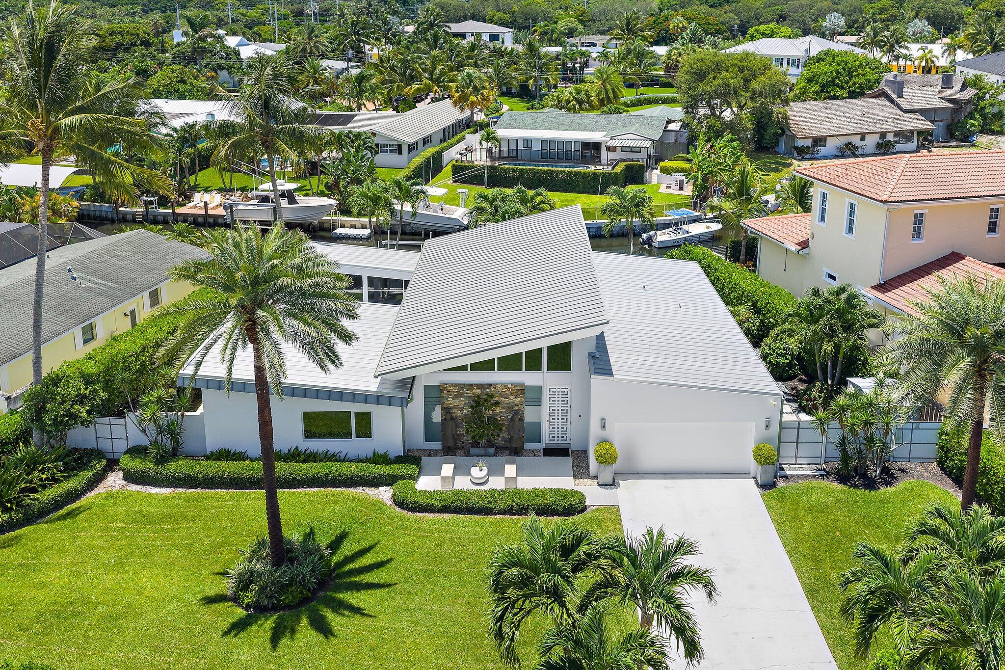 Waterfront Paradise on the Jupiter Line - Modern Living with a Nautical SoulLive the ultimate coastal lifestyle in this Frank Lloyd Wright-inspired masterpiece located on the coveted Jupiter line in Palm Beach Gardens. This fully reimagined and restored home blends modern elegance with unmatched functionality, meeting today's new construction codes while retaining timeless design appeal.Step inside to discover 2,300 square feet under air (3,000 total), thoughtfully designed for comfort, entertaining, and indoor-outdoor living. The sleek, chef-caliber kitchen features top-tier Sub-Zero, Bosch, and Gaggenau appliances, ideal for culinary creativity and hosting.