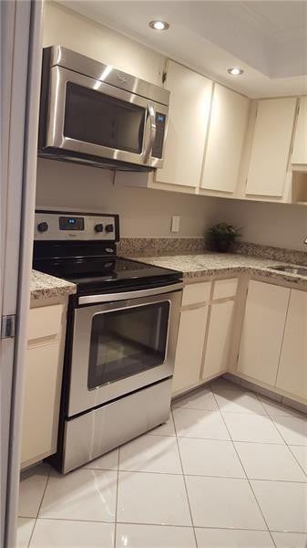 Photo of 3970 OAKS CLUBHOUSE Drive #310, Pompano Beach, FL 33069 (MLS # B26079896)