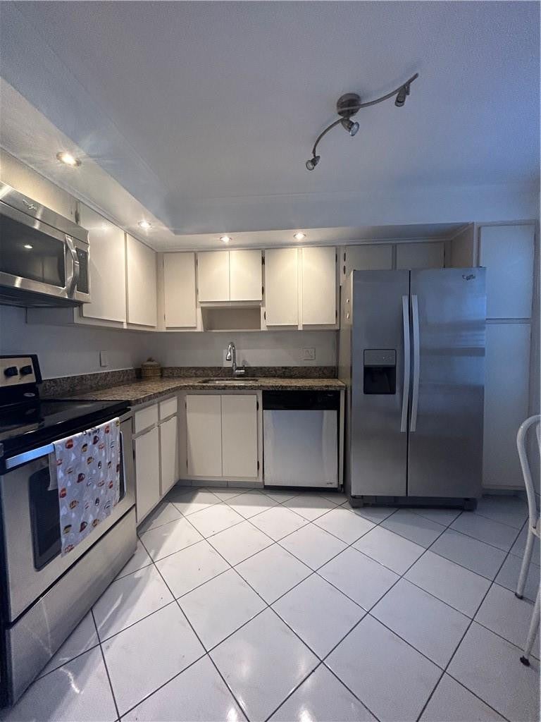 Photo of 3970 OAKS CLUBHOUSE Drive #310, Pompano Beach, FL 33069 (MLS # B26079896)