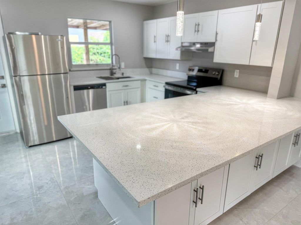 Photo of 3195 Mcsherry Drive, Lake Worth, FL 33461 (MLS # R11118985)