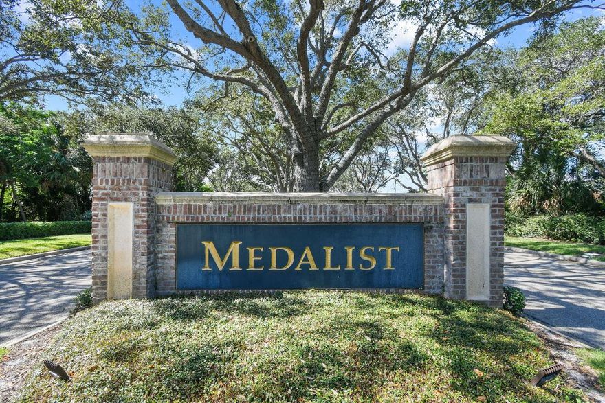 Seller will credit Buyer $35,000 for Membership Fee and $25,000 Capital Contribution at closing. Welcome to the prestigious Medalist Golf Community, where luxury meets nature! Surrounded by 870 acres of untouched Florida preserve, this gated enclave offers privacy and resort-style living. The Medalist Village features a 12-hole Par 3 course, Har-Tru tennis courts, fitness center, spa, and an Australian-inspired pub. This 4BR/4BA courtyard home includes a private separate guest suite, saltwater pool, and paved courtyard—perfect for entertaining. Highlights include 12-ft ceilings, open-concept living, bamboo flooring, and pool views from nearly every room. Bordered by preserve on two sides for exceptional privacy. Additional upgrades include a new metal roof (2023), new a/c (2022). Combining location, elegance, comfort, and peace of mind in one beautiful home! Conveniently located near beaches, restaurants, and shopping. Seller will credit Buyer $35,000 for Membership Fee and $25,000 Capital Contribution at closing.
