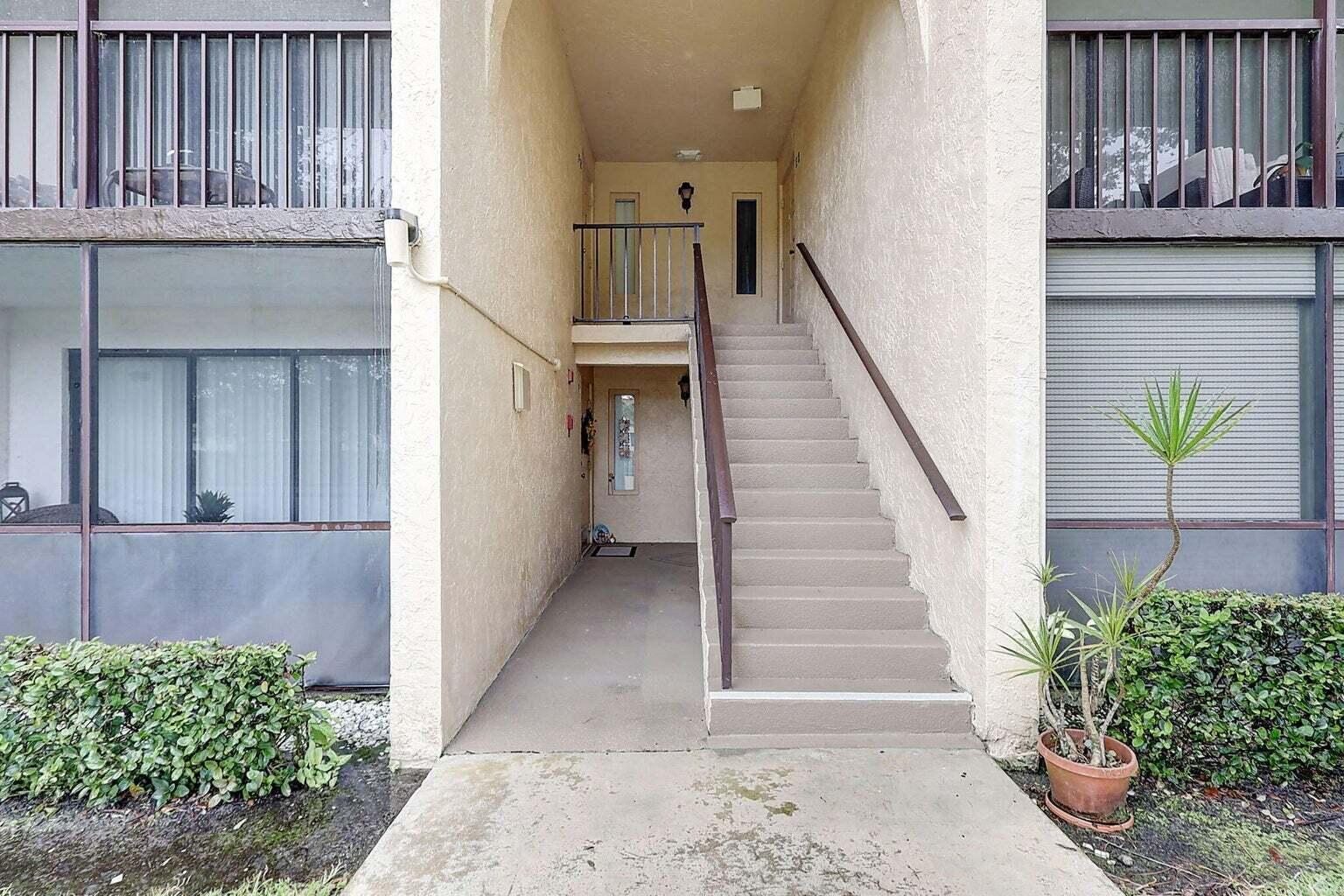 Beautiful 2-bedroom 2-bathroom condo. Active adult 55 and over community. Enjoy resort-style living with access to scenic walking trails, a heated pool and hot tub, clubhouse, tennis/pickleball and bocce courts, and more. This light-filled unit features tile flooring throughout, a spacious eat-in kitchen with newer stainless steel appliances, and a primary  bedroom complete with a walk-in closet. The secondary bedroom offers dual closets, ideal for guests or extra storage. A generous utility room includes a full-size washer and dryer for your convenience.Reasonable HOA dues include building insurance, roof maintenance, building maintenance, water, trash service & basic cable.