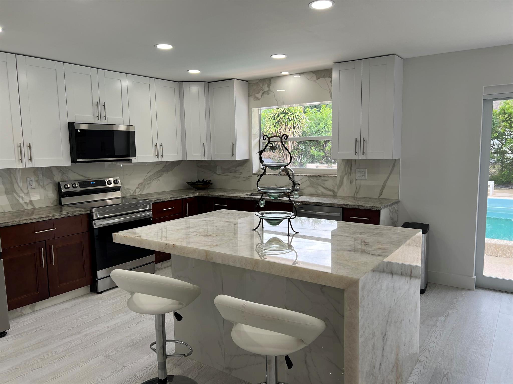 Beautifully renovated property with new flooring, all brand new appliances, quartz kitchen island and two fully remodeled bathrooms. Brand new A/C unit. Great location - 5 min walking distance to Trader Joe's at Delray Place. 1 mile from the beach. Large fenced backyard and pool shared with two other units. 3 unit building.
