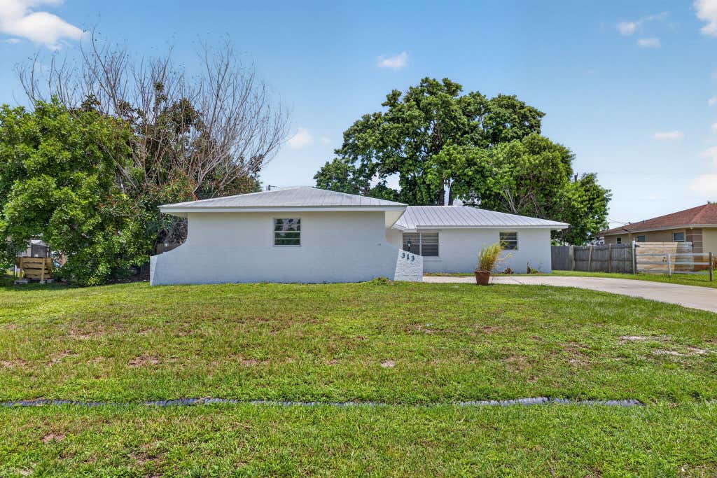 Photo of 313 SE Atlas Terrace, Port Saint Lucie, FL 34983 (MLS # B26058573)