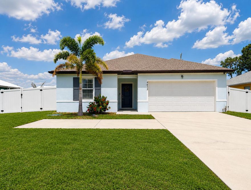 Port St. Lucie Dream Home in a Non-HOA Area between I-95 & the Turnpike! Built in 2022, this high-demand UPGRADED Palmera floor plan offers 4BR | 3BA | 2-Car Garage | SPLIT BEDROOM | PRIVATE APARTMENT SUITE with separate entrance, living room, kitchenette & driveway parking—suited for MULTI-GEN LIVING, GUESTS, BUSINESS SPACE, or RENTAL INCOME. UPGRADES include Luxury PLANTATION Shutters, SHIPLAP accents, built-in FIREPLACE, and DESIGNER CHANDELIER. Luxury finishes include TILE FLOORS throughout and a kitchen with GRANITE countertops, oversized island, 36" cabinets & GE stainless appliances. PRIMARY SUITE features a WALK-IN CLOSET and en-suite bath with dual vanities. Outside is a covered lanai plus VINYL PRIVACY FENCE & DOUBLE GATES on an OVERSIZED 10,000 sq ft lot with room for RV/BOAT.
