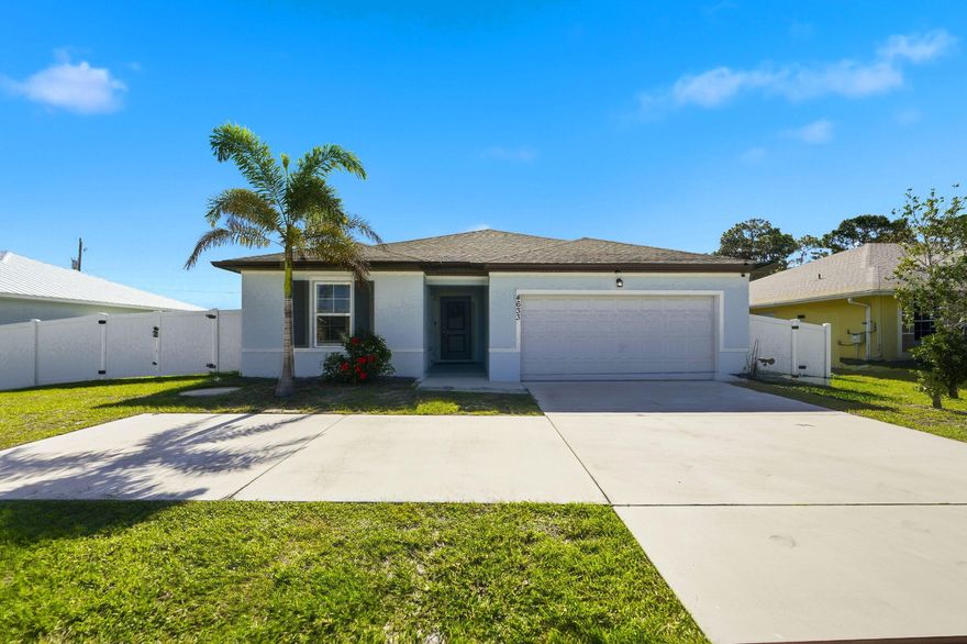 Port St. Lucie Dream Home in a Non-HOA Area between I-95 & the Turnpike! Built by K. Hovnanian®, the Palmera floor plan offers 4BR | 3BA | 2-Car Garage with a SPLIT BEDROOM layout featuring a PRIVATE APARTMENT SUITE with separate entrance, living room, kitchenette & driveway parking—ideal for MULTI-GENERATIONAL living, GUESTS, OFFICE, or RENTAL INCOME. The home boasts TILE FLOORING throughout and a kitchen with GRANITE countertops, oversized island, 36" cabinets & GE stainless appliances. PRIMARY SUITE features a WALK-IN CLOSET and en-suite bath with dual vanities. This NEWER 2020 Home has UPGRADES including SHIPLAP accents, built-in FIREPLACE, and DESIGNER CHANDELIER. Outside is a covered lanai plus VINYL PRIVACY FENCE & DOUBLE GATES on an OVERSIZED 10,000 sq ft lot with room for RV/BOAT.