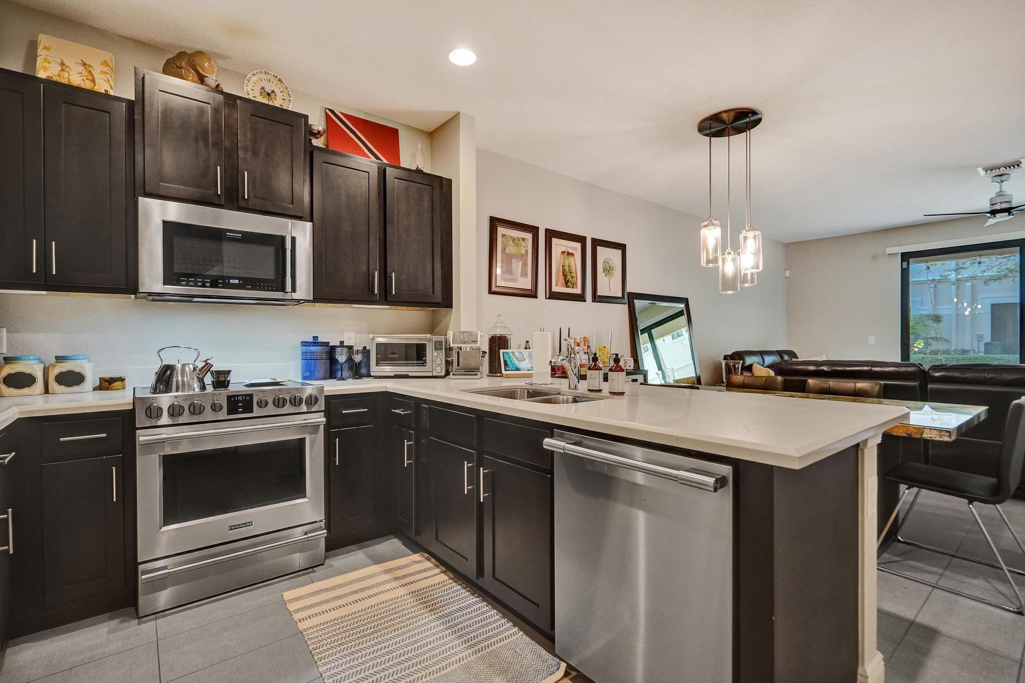 Beautiful two-story 3 bed, 2.5 bath townhome with a covered patio and attached garage. The gourmet kitchen features quartz countertops, 36" wood cabinets, and premium stainless steel appliances. Enjoy impact windows, an open floor plan with over 9' ceilings, and elegant ceramic tile. The spacious master suite offers French doors, two closets (including a large walk-in), and a walk-in shower. Located in the heart of Oakland Park, just minutes from the beach, shopping, dining, and I-95. This quiet, pet-friendly community boasts a pool, walking path, playground, lush landscaping, plenty of parking, and a green community garden. Close to downtown Oakland park with shops and restaurants and Jaco Pastorius park.