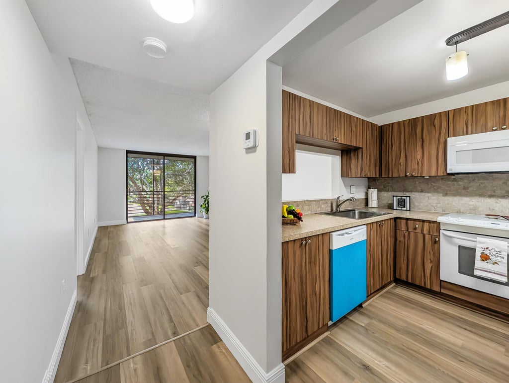 Photo of 900 Colony Point Circle #205, Pembroke Pines, FL 33026 (MLS # B26079889)