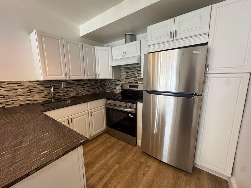 Beautiful and spacious studio efficiency for rent featuring a private entrance and small yard, offering comfort and privacy. This large studio (no separate bedroom) includes a full kitchen with stainless steel appliances, a full bathroom, and a generously sized living/sleeping area with a large closet. Laundry room is conveniently located in the main house, and electricity, water, garbage, and sewer are all included in the rent. The unit is unfurnished, no pets and non-smokers only. First month and security deposit move you in, with fast approval and easy to show.