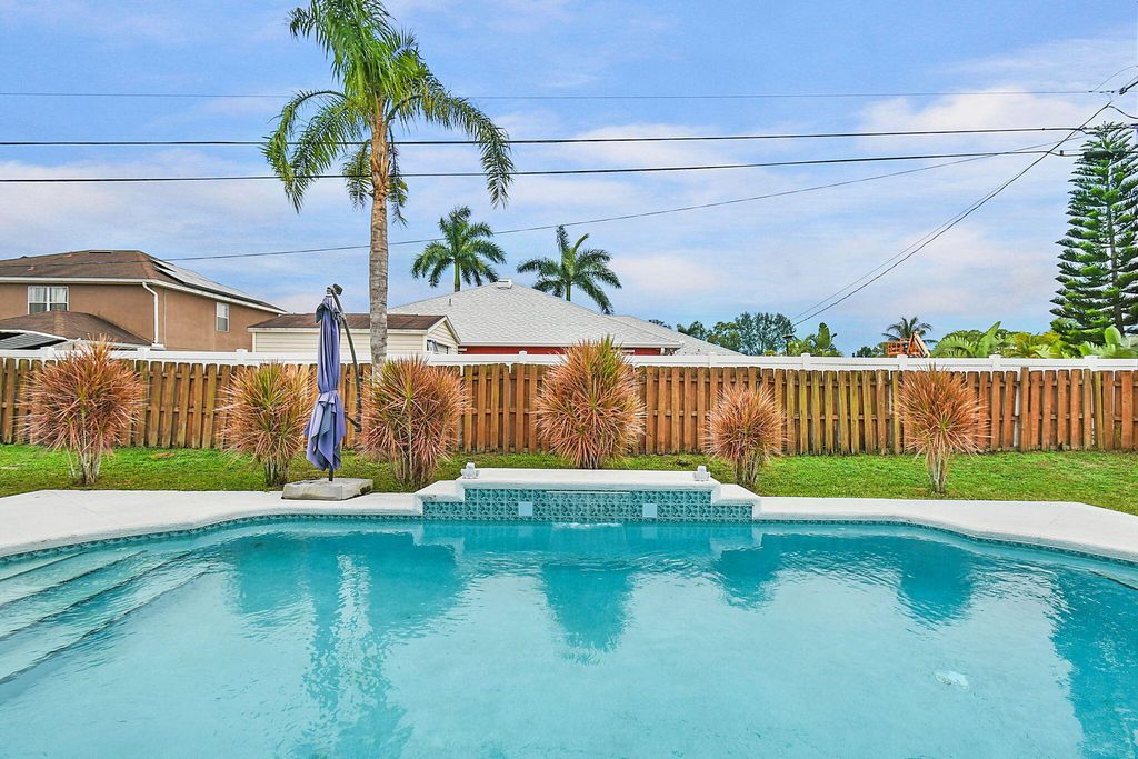 Photo of 1592 SW Aledo Lane, Port Saint Lucie, FL 34953 (MLS # R11055108)