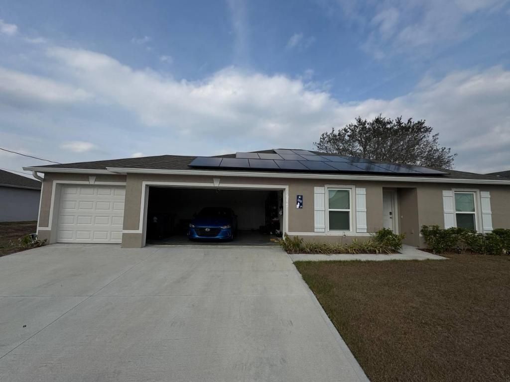 Photo of 619 SW Hamberland Avenue, Port Saint Lucie, FL 34953 (MLS # R11157972)