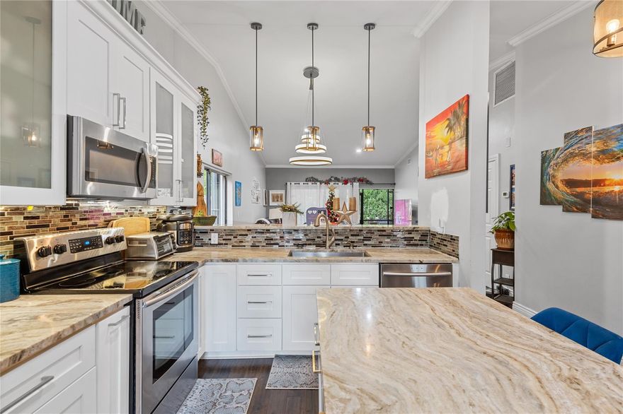 Exquisite 2BR/2BA corner unit with a touch of perfection! Completely remodeled, featuring modern aesthetics and premium finishes throughout. New Refrigerator and new washer and dryer. Brand new whole House 3-Stage Water Filtration System. Beautiful hardwood floors throughout the house. The spacious layout creates an inviting atmosphere, while the beautiful yard adds an element of tranquility. Don't miss out on this rare gem - a harmonious blend of style and comfort. Contact us for a private tour and discover the beauty within.