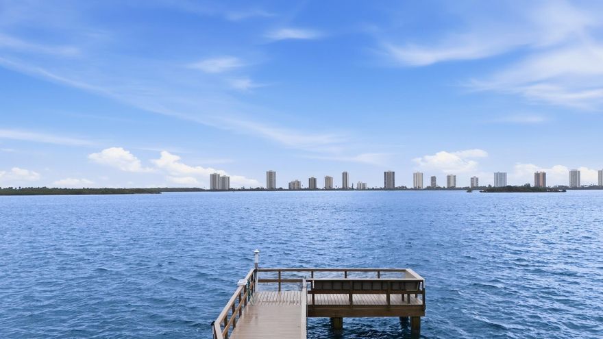 Welcome to Shore Club—an inviting waterfront Intracoastal community where style, comfort, and value come together in this beautifully reimagined 1-bedroom, 1-bath designer condo. This move-in ready residence showcases high-end finishes throughout, including hurricane impact glass windows and doors, a brand-new HVAC system, and a thoughtfully updated interior with grass cloth wall coverings, custom window treatments, and an upgraded lighting package for a sophisticated, contemporary feel. Every detail has been thoughtfully curated, creating a refined space that feels far above its price point. The sleek kitchen is equipped with high-end appliances, including an induction cooktop, blending performance with modern design Offered furnished for immediate enjoyment, this exceptional home also allows rentals after one year and benefits from sound reserves. The owner is relocating north, presenting a rare opportunity to own this waterfront "gem" in a prime location—offered below the prior sale price. Nothing to do but move in and enjoy coastal living at its best.  Shore Club is a charming and sought-after Intracoastal community offering the perfect blend of waterfront lifestyle and financial stability. Residents enjoy direct access to the Intracoastal, a private fishing dock, and a refreshing community pool—ideal for relaxing and embracing the Florida lifestyle. The building stands out with a new roof, healthy reserves, reasonable HOA fees, and an attractive tax structure, providing peace of mind and long-term value. Financially sound and well maintained, Shore Club is a standout in today's condo market—delivering the stability today's buyers are looking for.