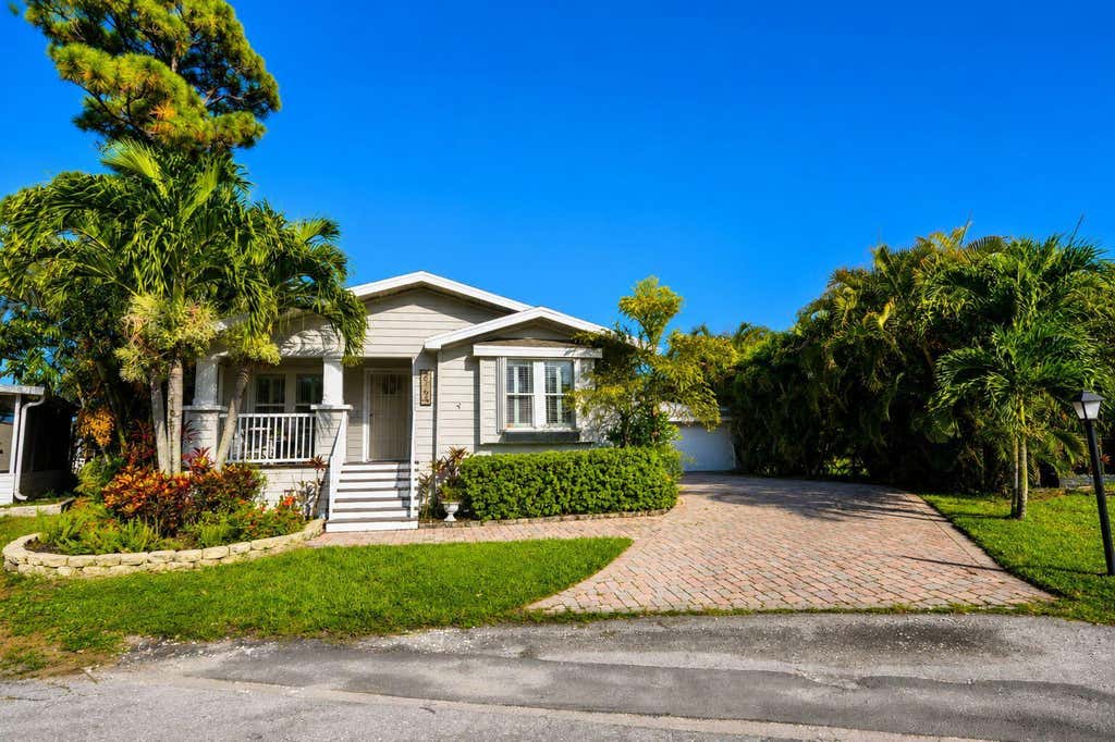 Photo of 6164 N Ironwood Lane, Atlantis, FL 33462 (MLS # B26063293)