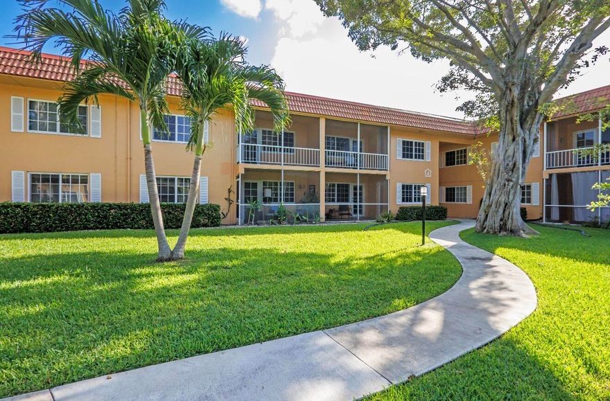 Priced to sell!  No land lease! Beautifully updated large 1-bedroom, 1.5-bath ground-floor condo located in the heart of vibrant Wilton Manors, just steps from world-famous Wilton Drive! This move-in ready residence features tile flooring throughout, a custom wood kitchen with granite countertops & black & stainless appliances, hurricane impact windows, and fully upgraded modern baths. Spacious screened patio offers a peaceful setting overlooking a beautifully manicured lawn and mature trees — perfect for relaxing or entertaining. Prime central location close to shopping, dining, nightlife, and all that Wilton Manors has to offer!  Complex features, 2 pools, clubrooms, tennis and pickleball courts, beautiful walking paths, pristinely maintained buildings, property, and grounds.