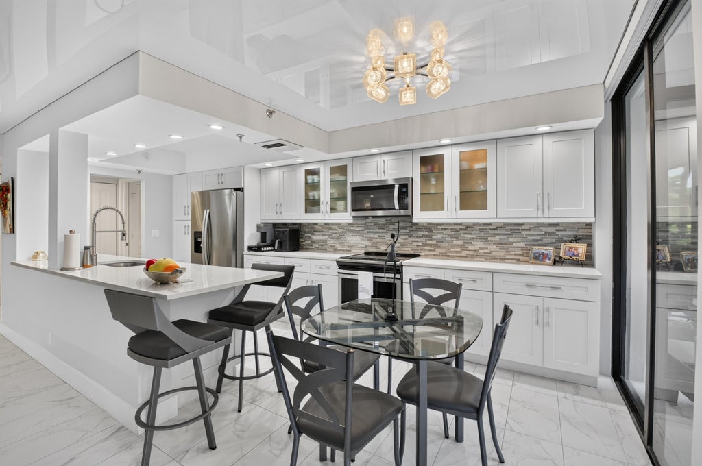 Photo of 20090 Boca West Drive #317, Boca Raton, FL 33434 (MLS # B26066565)