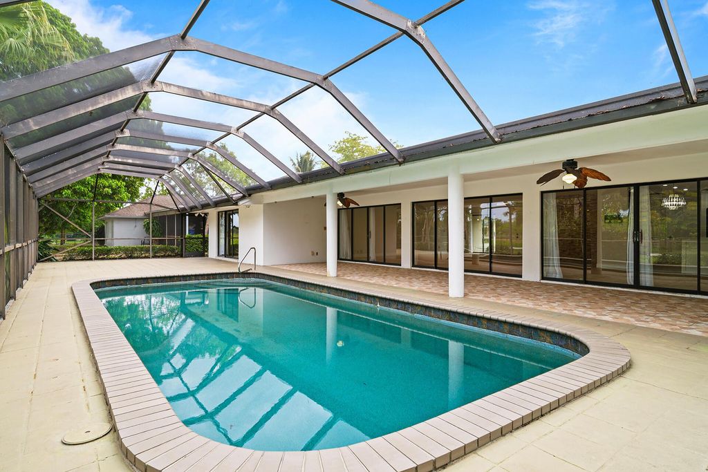 Photo of 125 Sandpiper Avenue, Royal Palm Beach, FL 33411 (MLS # R11074471)