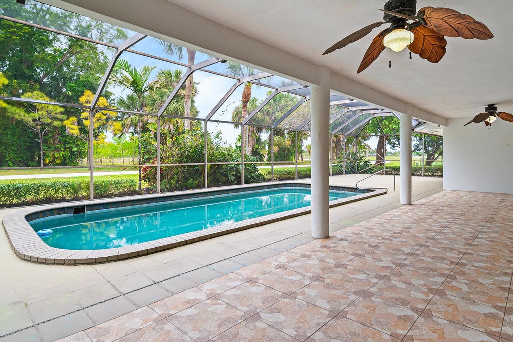Photo of 125 Sandpiper Avenue, Royal Palm Beach, FL 33411 (MLS # R11074471)
