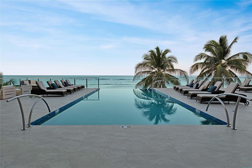 Welcome to Timeless Paradise! Discover unparalleled Caribbean grandeur and indulge in luxurious island living at this exclusive vacation villa, nestled in the prestigious Rum Point neighborhood. This beachfront paradise is more than just a home, it's an experience you won't soon forget. This newly constructed, 3-story ocean estate stands 18 ft above sea level and spans an astounding 15,000 sqft. All 11 bedrooms and 13 bathrooms were meticulously designed with lavish fixtures and designer furnishings. Upon entering through the grand entryway, you'll be greeted with elevated panoramic ocean views that will leave you breathless. The villa's open floor plan, punctuated with 11-ft ceilings and a stunning blue granite accent wall, offers seamless flow from the kitchen, dining, and living areas.