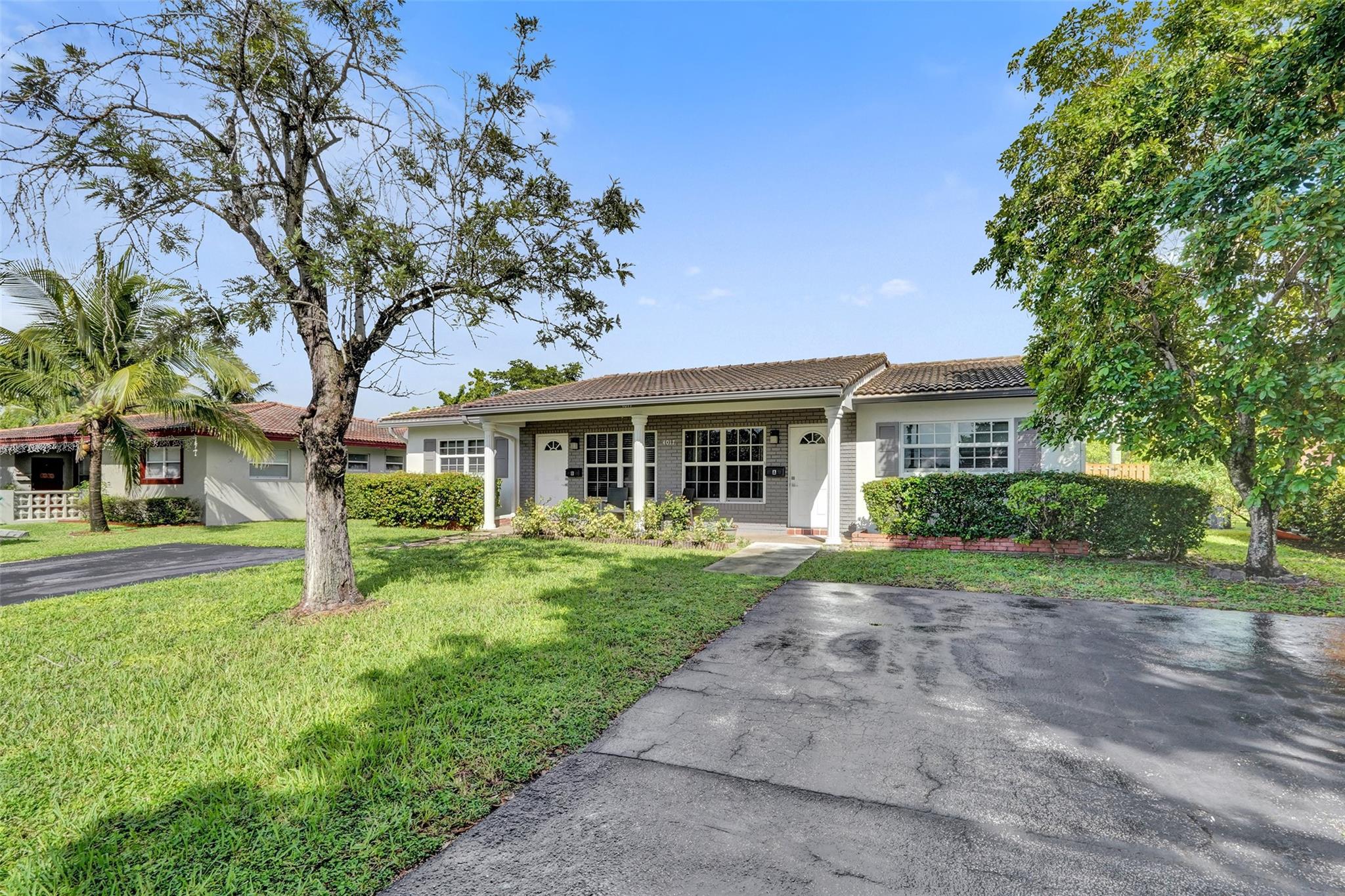 Turnkey duplex investment in Coral Springs showing two renovated 2 bed 2 bath units with fresh flooring, upgraded lighting, and modern kitchens with new appliances. Each side includes washer and dryer, private entrances, and impact windows. The exterior features updated landscaping, a spacious fenced yard, and relaxing canal views. Parking for several cars. Well maintained with strong rental demand, with room to improve returns through market adjustments.