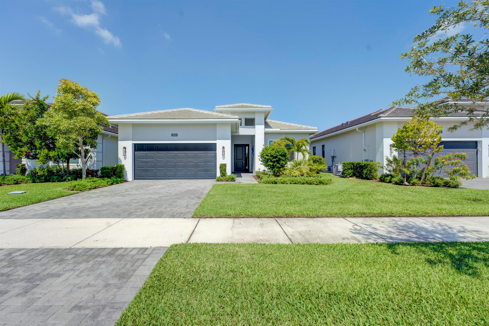 Welcome to this highly sought-after Fiesta Model featuring 3 spacious bedrooms, 3 full baths, a versatile den, and a bright open floor plan perfect for modern living. The large kitchen is a showstopper with two-tone soft-close cabinetry, a large 3.5'' quartz island, stainless steel appliances, and quartz countertops throughout.Enjoy the beauty of tile flooring across the entire home, 10-foot tray ceilings, and floor-to-ceiling tile in bathrooms. The luxurious primary suite offers a beach-access walk-in shower and custom finishes for a spa-like experience.Built for comfort and efficiency, this home has a tankless water heater, impact windows and sliders and a hurricane-rated 2-car garage door with sleek epoxy floors.