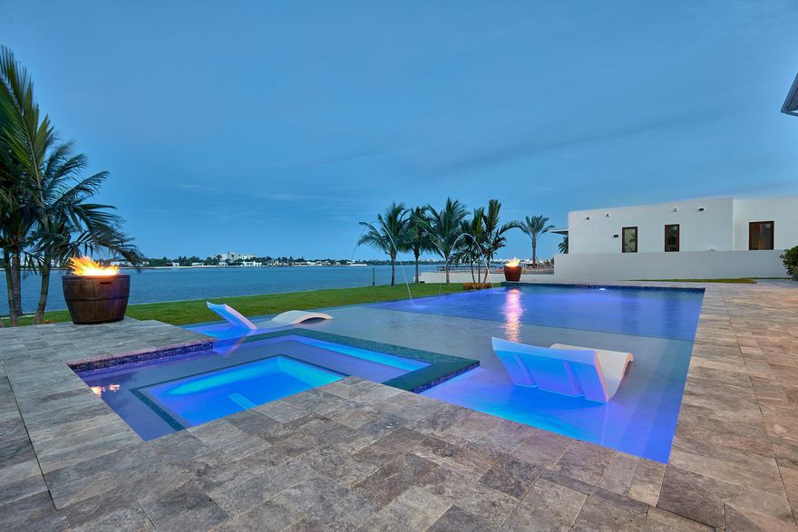 Appraised on 9/21/17 for $3,100,000 This unique brand new deep water property can handle large boats and large yachts. Builder currently has a 100ft DEP Dock permit in hand. Quality was our first consideration when designing and building this brand new contemporary masterpiece on over a 100' lot, directly on the intracoastal, with quick ocean access. Walk through the front door to a beautifully open and versatile great room with gorgeous tall ceilings and crown molding. The home was installed with impact-resistant, tinted windows and sliding doors. Upon opening the sliding doors you view the magnificent infinity pool and spa with custom water features which overlooks the very wide waterway. If staying indoors, simply relax in this tranquil 4590 square foot living area under air.