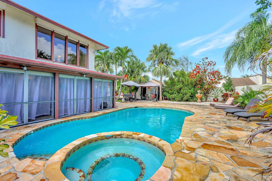 A one of a kind spacious POOL Home with huge resort style courtyard, corner Lot on a lake, beautiful private patio area that's fully fenced, The floor plan provides the main bedroom with bahama shutters, custom closet, renovated bathroom with spa like shower and overhead rain spout. Updated kitchen opens to the courtyard. The living & dining area is open & surrounded by sliding glass doors with lots of natural light, huge screened in patio off the living & main bedroom. 2nd floor Loft makes a great office space or entertainment area. 2 Bedrooms have a Jack & Jill bathroom with wood floors throughout. This home has so many amazing features, low maintenance $265 per month includes internet & cable, community offers pool, tennis/pickleball, fitness center, basketball. Mins to downtown Delray.