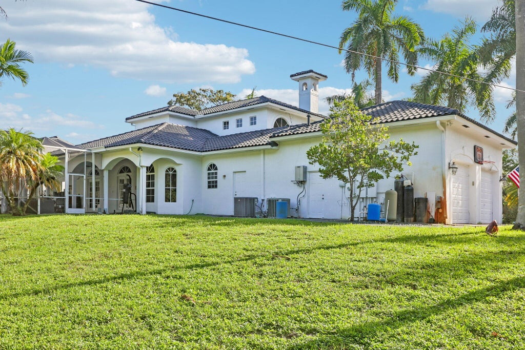 Photo of 6911 NW 84TH Avenue, Parkland, FL 33067 (MLS # B26077504)