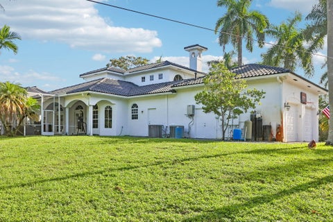 Photo of 6911 NW 84TH Avenue, Parkland, FL 33067 (MLS # B26077504)