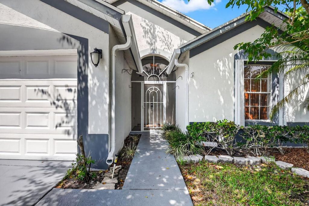 Photo of 412 Trotters Lane, Greenacres, FL 33413 (MLS # R11136218)