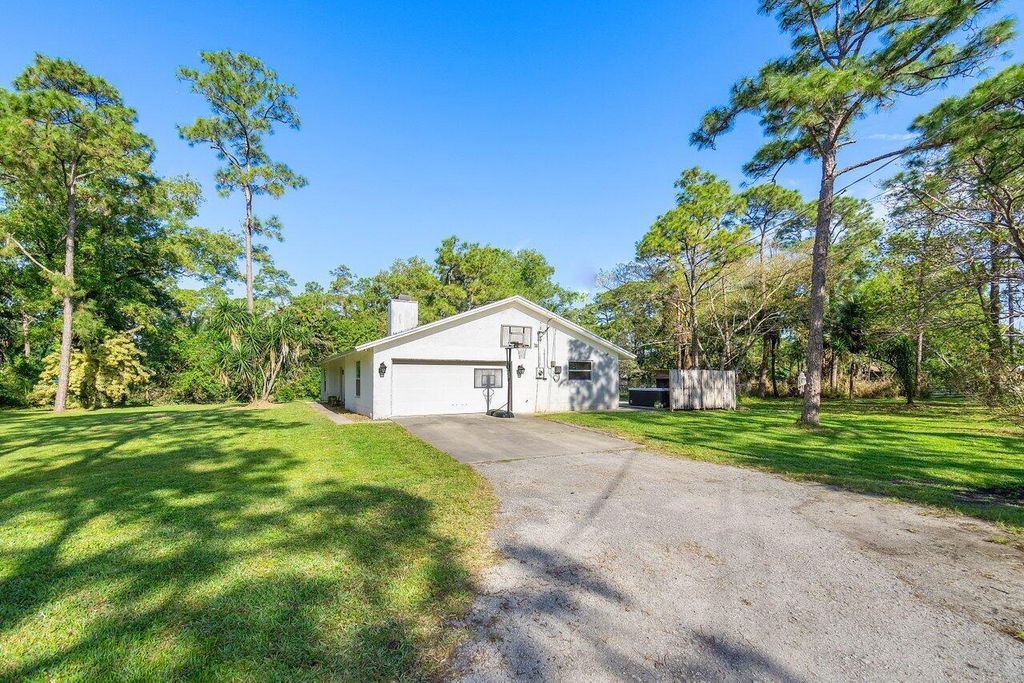 Photo of 11715 52nd Road N, The Acreage, FL 33411 (MLS # R10969149)