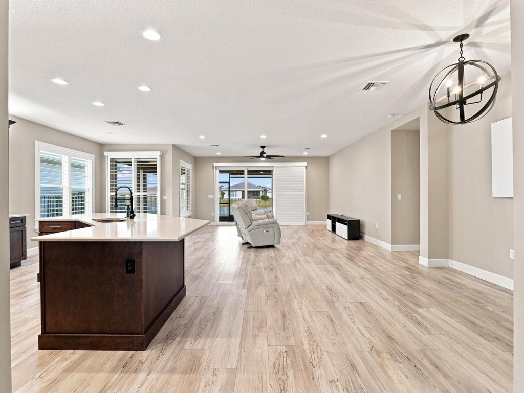Photo of 11750 SW Coral Cove Parkway, Port Saint Lucie, FL 34987 (MLS # B26076921)