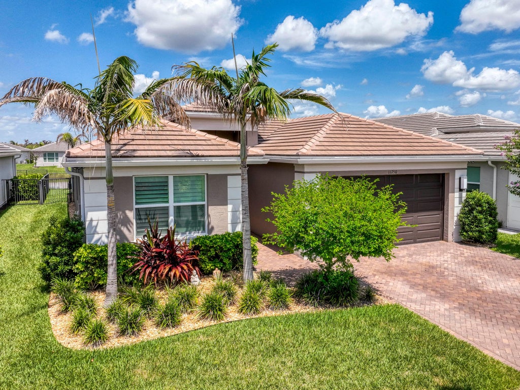 Photo of 11750 SW Coral Cove Parkway, Port Saint Lucie, FL 34987 (MLS # B26076921)