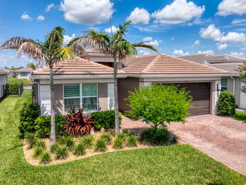 Photo of 11750 SW Coral Cove Parkway, Port Saint Lucie, FL 34987 (MLS # B26076921)