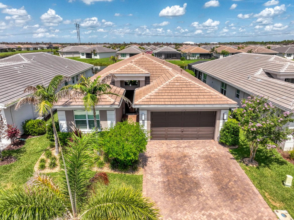 Photo of 11750 SW Coral Cove Parkway, Port Saint Lucie, FL 34987 (MLS # B26076921)