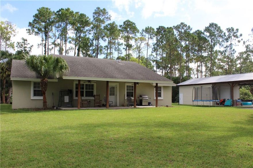 One of a kind house with with huge out building (48x24). Three bedroom, two bath with large ranch style porch, on 1.20 acres. Fully fenced in and gated yard off a paved road.  The 48x24 out building makes the total square footage closer to 3,200 sqft. Perfect starter or family home and wont last at this price!