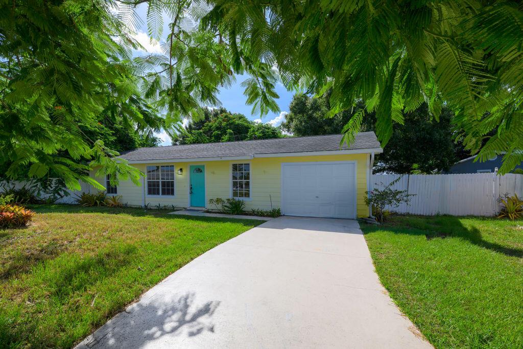 Charming, move-in ready home on a spacious corner lot with welcoming character throughout. Featuring durable HardiePlank concrete siding, laminate and tile flooring, and a large backyard with an irrigation well. The inviting patio offers a great space to unwind, and the pride of ownership is evident. Conveniently located near Walmart, St Lucie Hospital, Green River Parkway, and the Savannas Preserve State Park--with Jensen Beach just 20 minutes away. A perfect option for first-time buyers or those seeking a sunny seasonal escape.