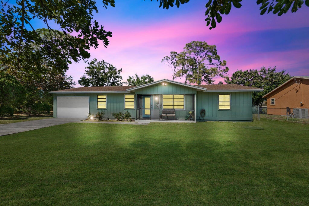 Photo of 287 SW Moselle Avenue, Port Saint Lucie, FL 34984 (MLS # R10972964)