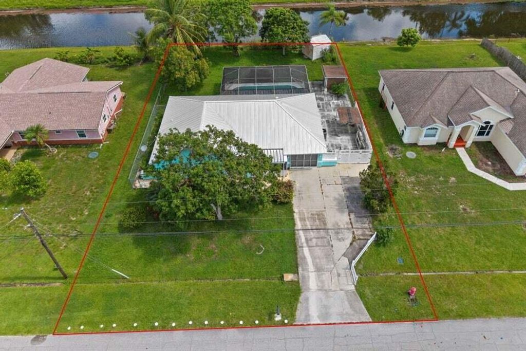 Photo of 301 SW Whitmore Drive, Port Saint Lucie, FL 34984 (MLS # R11121231)
