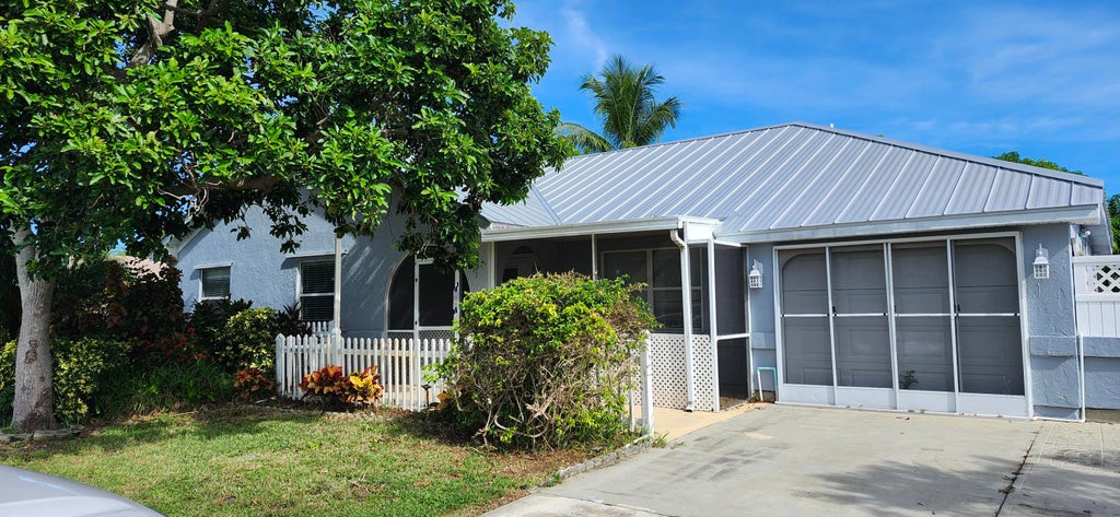 Photo of 301 SW Whitmore Drive, Port Saint Lucie, FL 34984 (MLS # R11121231)