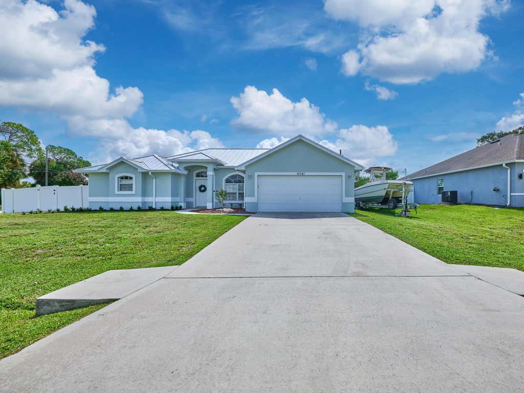 Photo of 4501 SW TABOR Street, Port Saint Lucie, FL 34953 (MLS # B26059555)