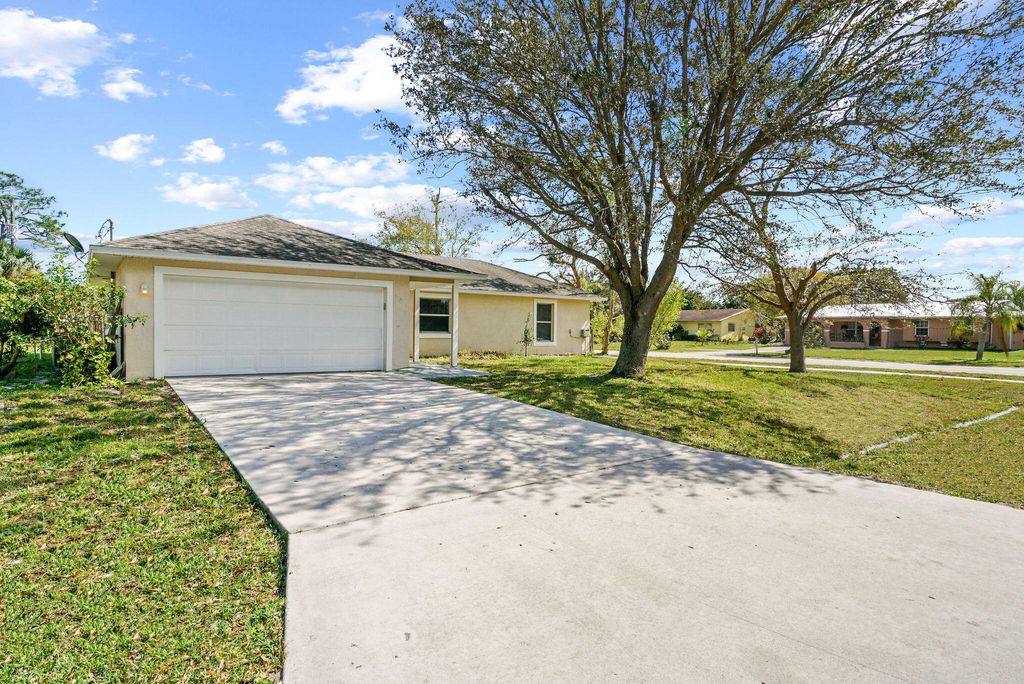 Photo of 401 NE Mainsail Street, Port St Lucie, FL 34983 (MLS # R10865142)