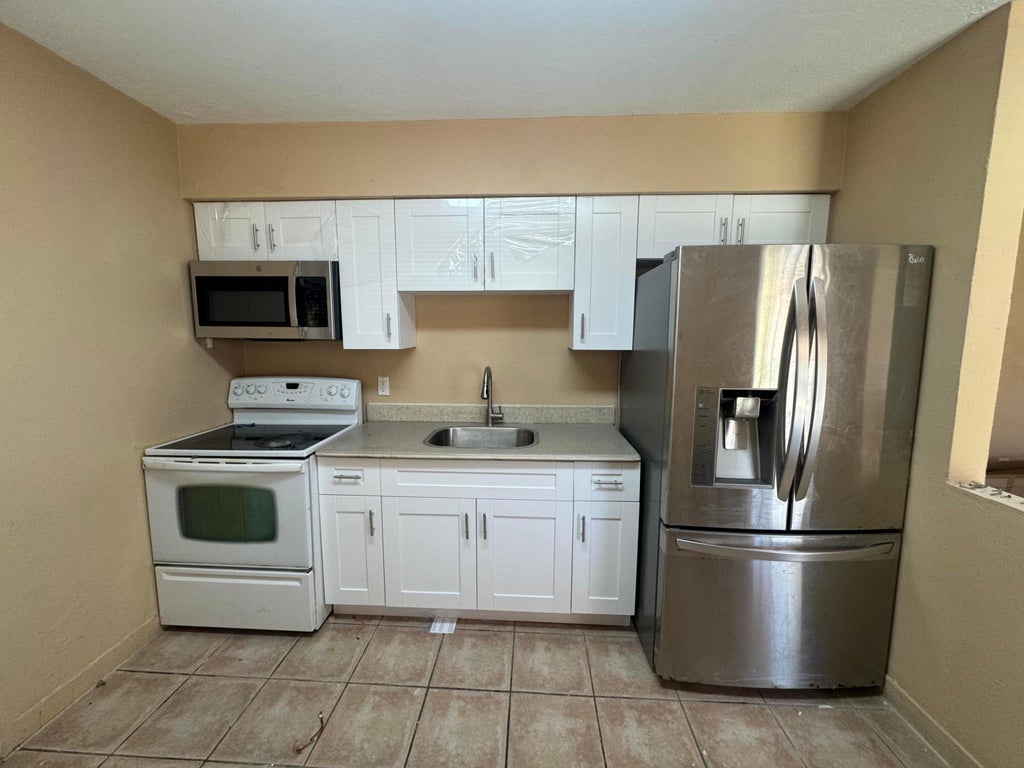 Photo of 210 SW 2nd Terrace, Dania Beach, FL 33004 (MLS # B26024265)